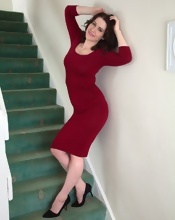 Busty MILF gets naked on stairs in the hairy pussy pics